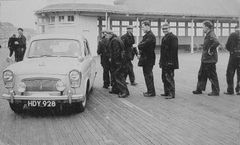 Pier-maintenace-workers-lining-up-to-get-paid-1958